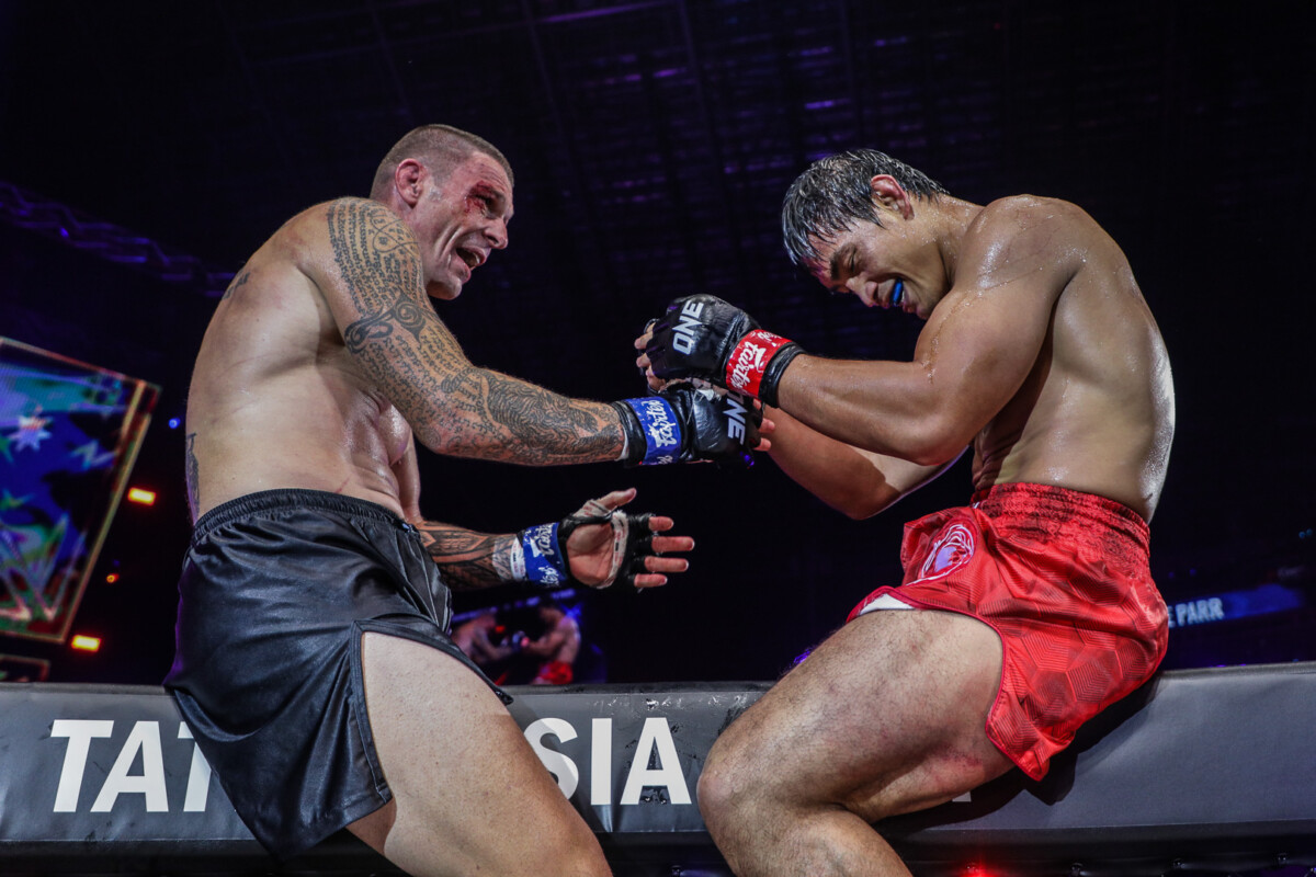 Eduard Folayang and John Wayne Parr share a light moment after their lightweight Muay Thai showdown at ONE X