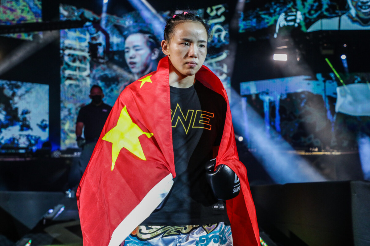 Chinese strawweight kickboxer Lin Heqin makes her way to the Circle at ONE: LIGHTS OUT