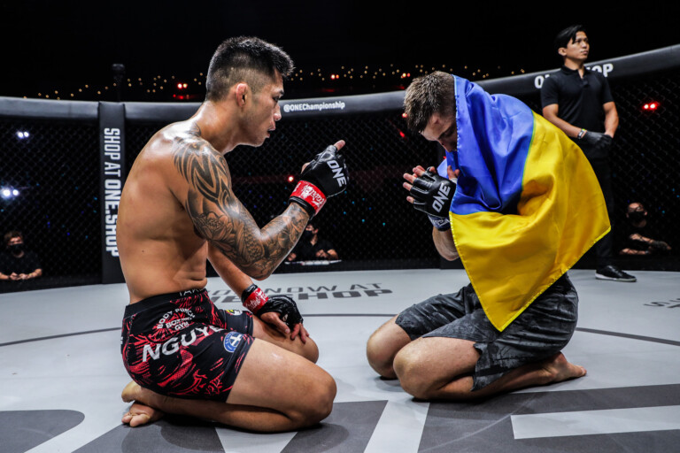 Martin Nguyen and Kirill Gorobets share a moment of respect after their featherweight MMA fight at ONE: LIGHTS OUT