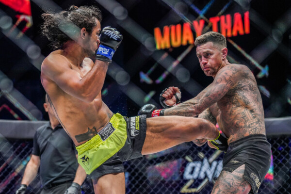 Sinsamut Klinmee lands a powerful left kick on Nieky Holzken at ONE X: Part I