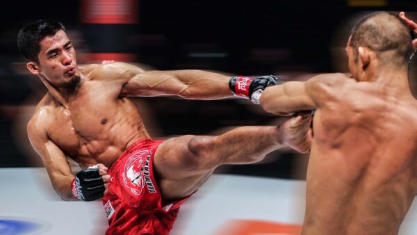 Stephen Loman lands a painful side kick on Shoko Sato