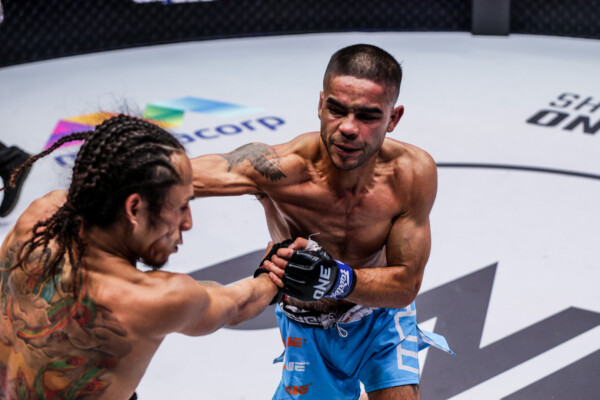 Danial Williams lands a punch against Namiki Kawahara at ONE 156