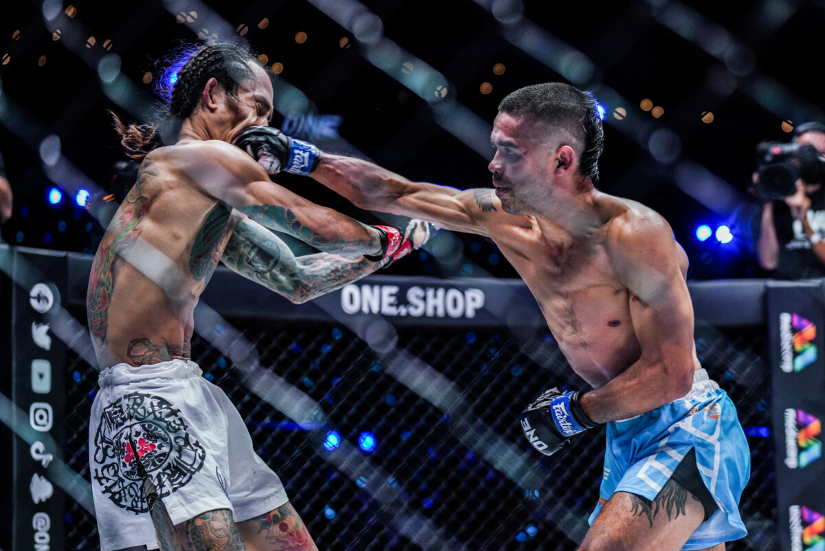 Danial Williams delivers a powerful cross against Namiki Kawahara at ONE 156