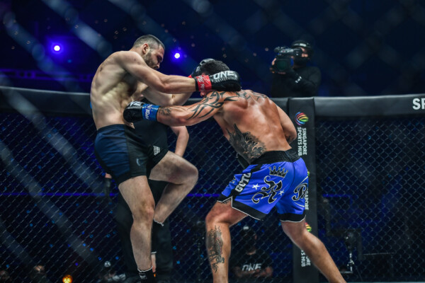 Guto Inocente lands a body punch on Rade Opacic at ONE 158