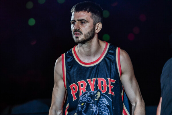 Savvas Michael enters the arena with his Pryde shirt
