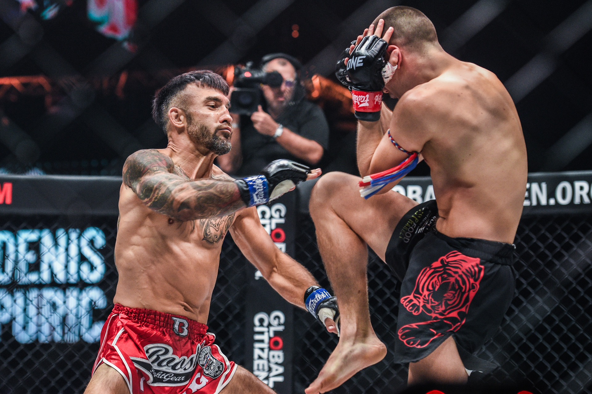 Tagir Khalilov and Denis Puric exchange blows