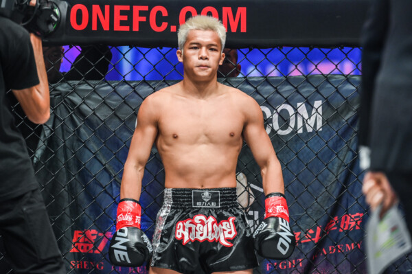 Zhang Peimian stands in the Circle