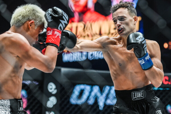 Canadian kickboxer Jonathan Di Bella lands punches on Zhang Peimian