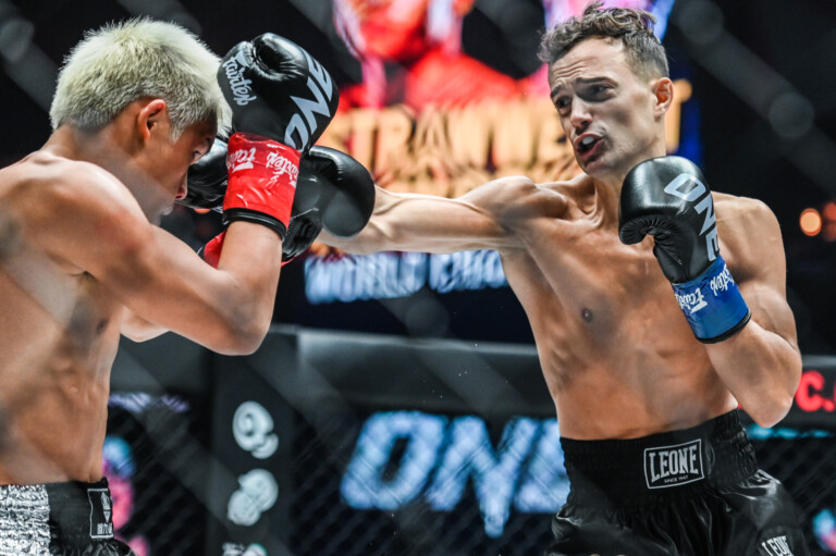 Canadian kickboxer Jonathan Di Bella lands punches on Zhang Peimian