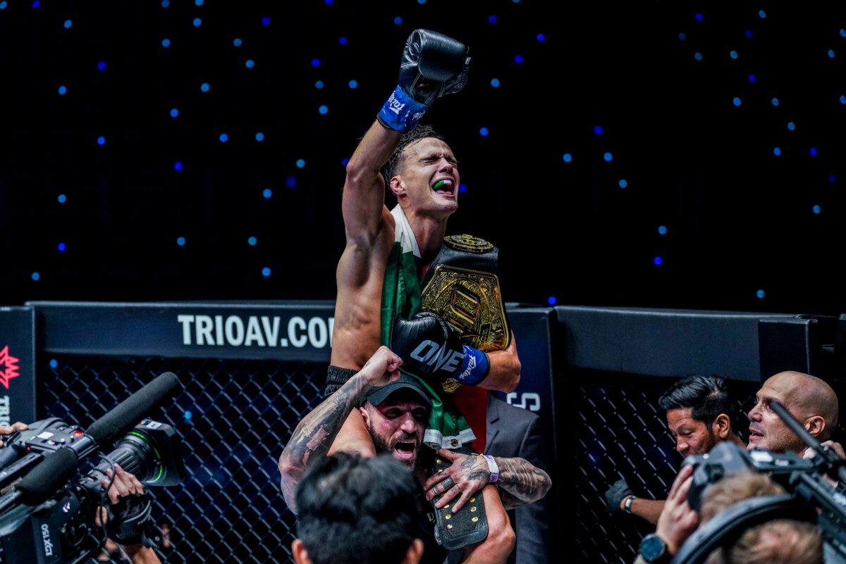 Jonathan Di Bella celebrates winning the ONE Strawweight Kickboxing World Championship