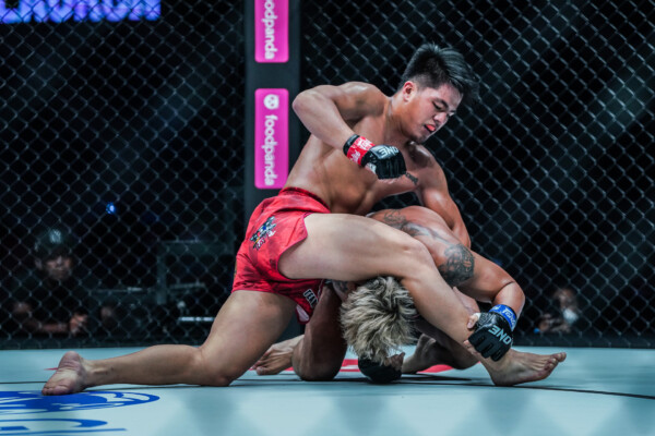 Jhanlo Mark Sangiao grapples with Anacleto Lauron at ONE 164