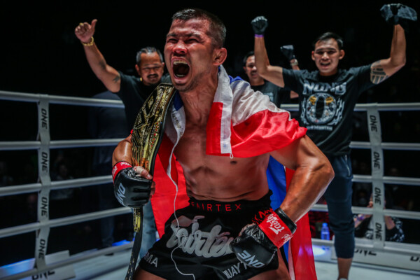 Nong-O Gaiyanghadao poses with the ONE World Title belt following his win over Alaverdi Ramazanov