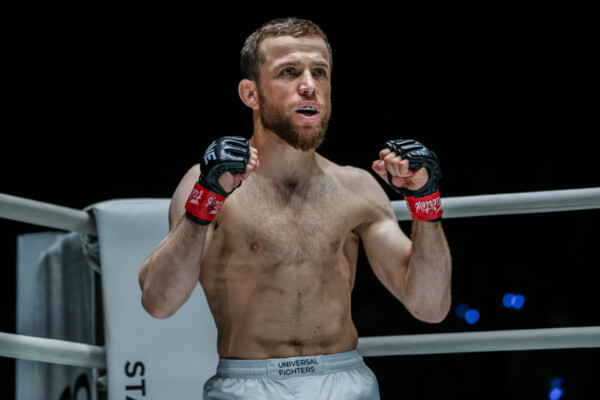 Russian MMA fighter Mansur Malachiev stands in the corner of the ring
