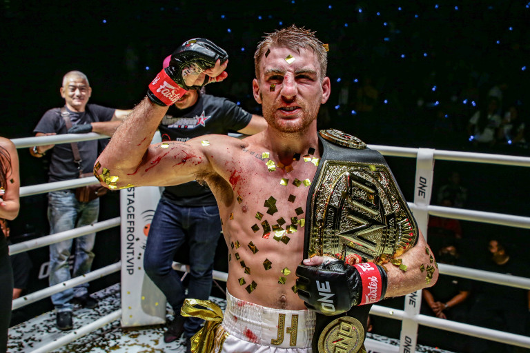 Jonathan Haggerty with the ONE Flyweight Muay Thai World Championship belt