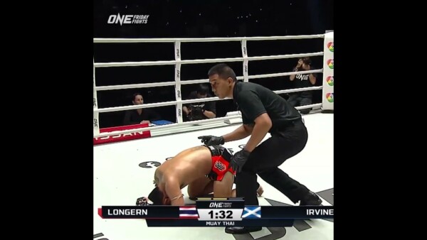 GUT CHECK  Stephen Irvine scores a body shot knockdown!