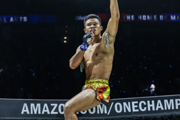 Muay Thai star Superlek poses above the Circle