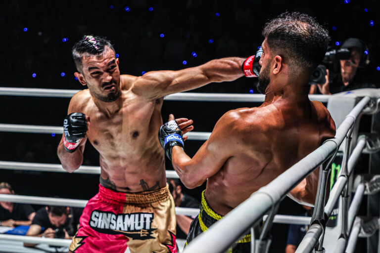 Muay Thai fighter Sinsamut Klinmee punches Youssef Assouik in the ring