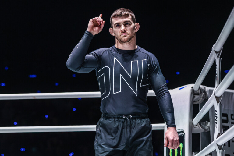 Dante Leon holds one finger up in the ring