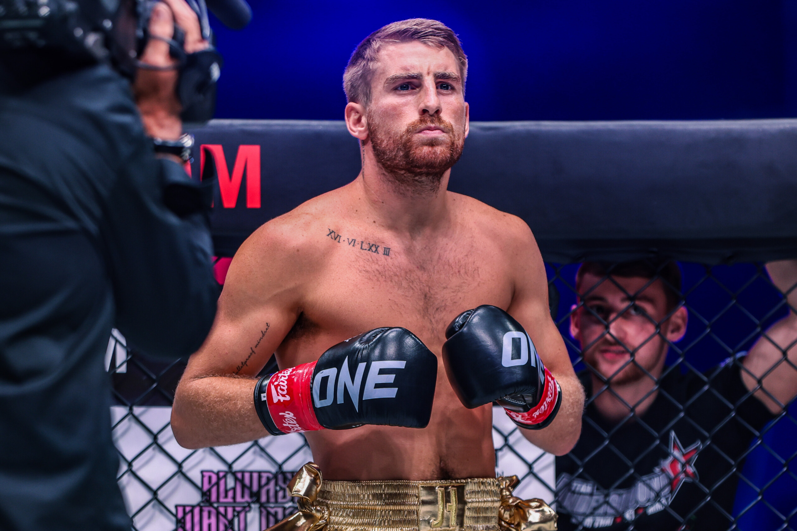 Jonathan Haggerty stands in the ring, ready for his kickboxing fight