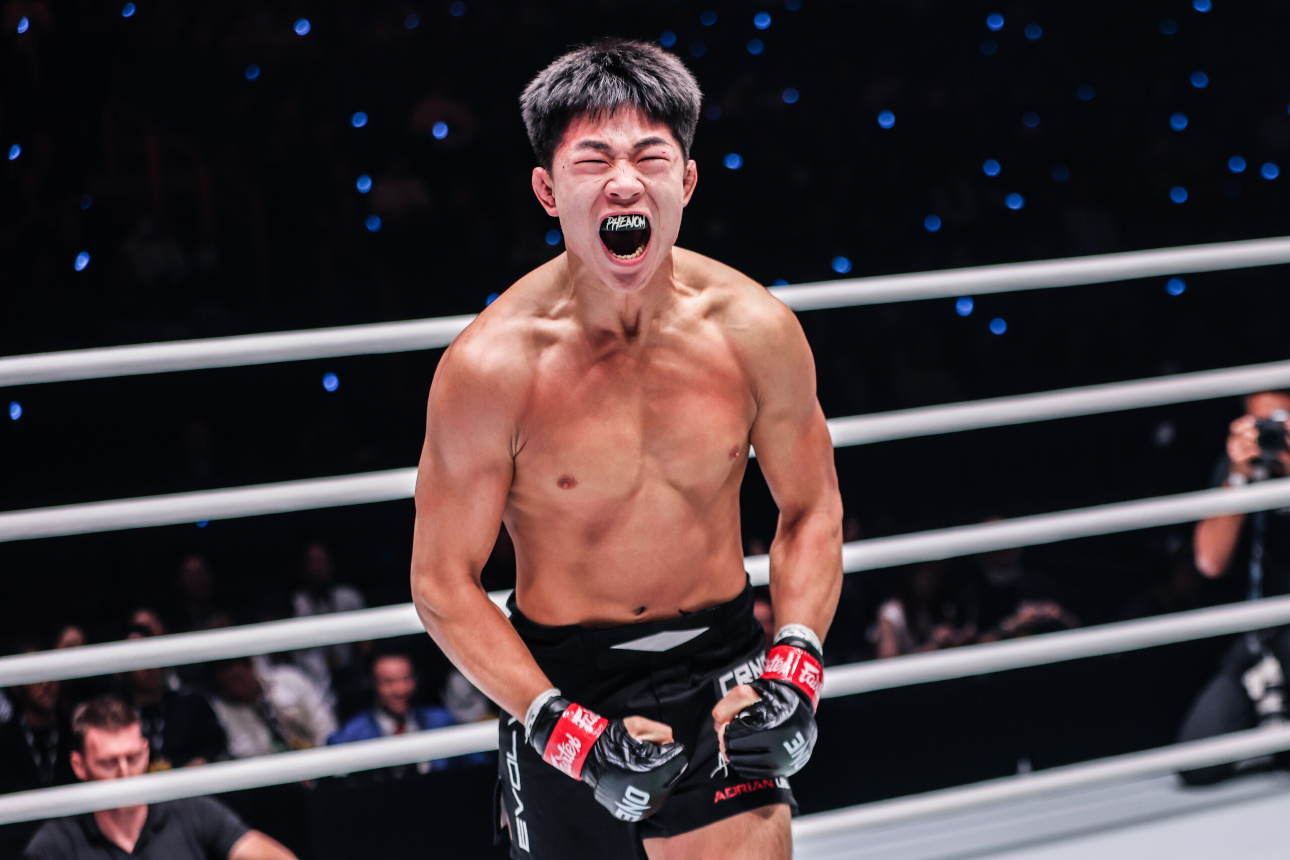 MMA fighter Adrian Lee screams in the ring