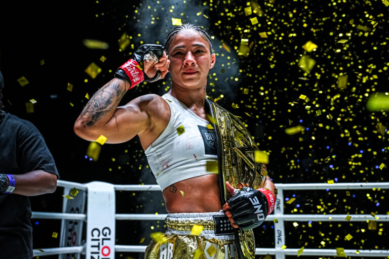 ONE Women's Atomweight Muay Thai World Champion Allycia Hellen Rodrigues celebrates her title win.