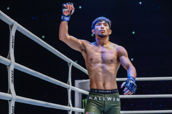 Japanese MMA fighter Yuya Wakamatsu raises his arm in the air