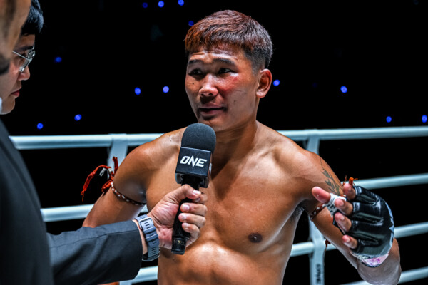 “Left Meteorite” Ratchasiesan Laochokcharoen, formerly known as Kulabdam, speaks into the microphone