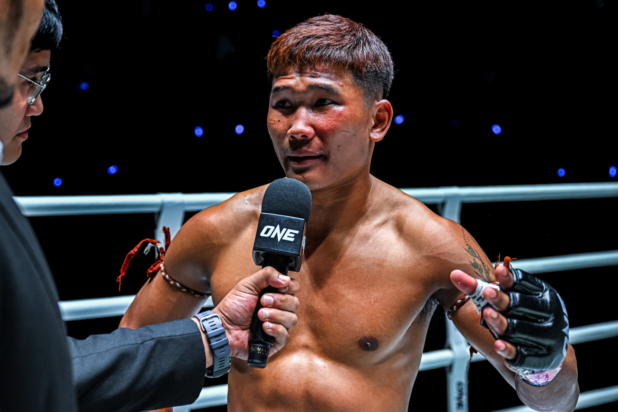 “Left Meteorite” Ratchasiesan Laochokcharoen, formerly known as Kulabdam, speaks into the microphone