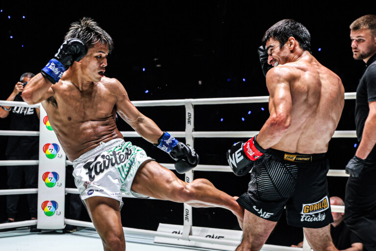 Japanese kickboxing star Yuki Yoza lands a calf kick on Elbrus Osmanov
