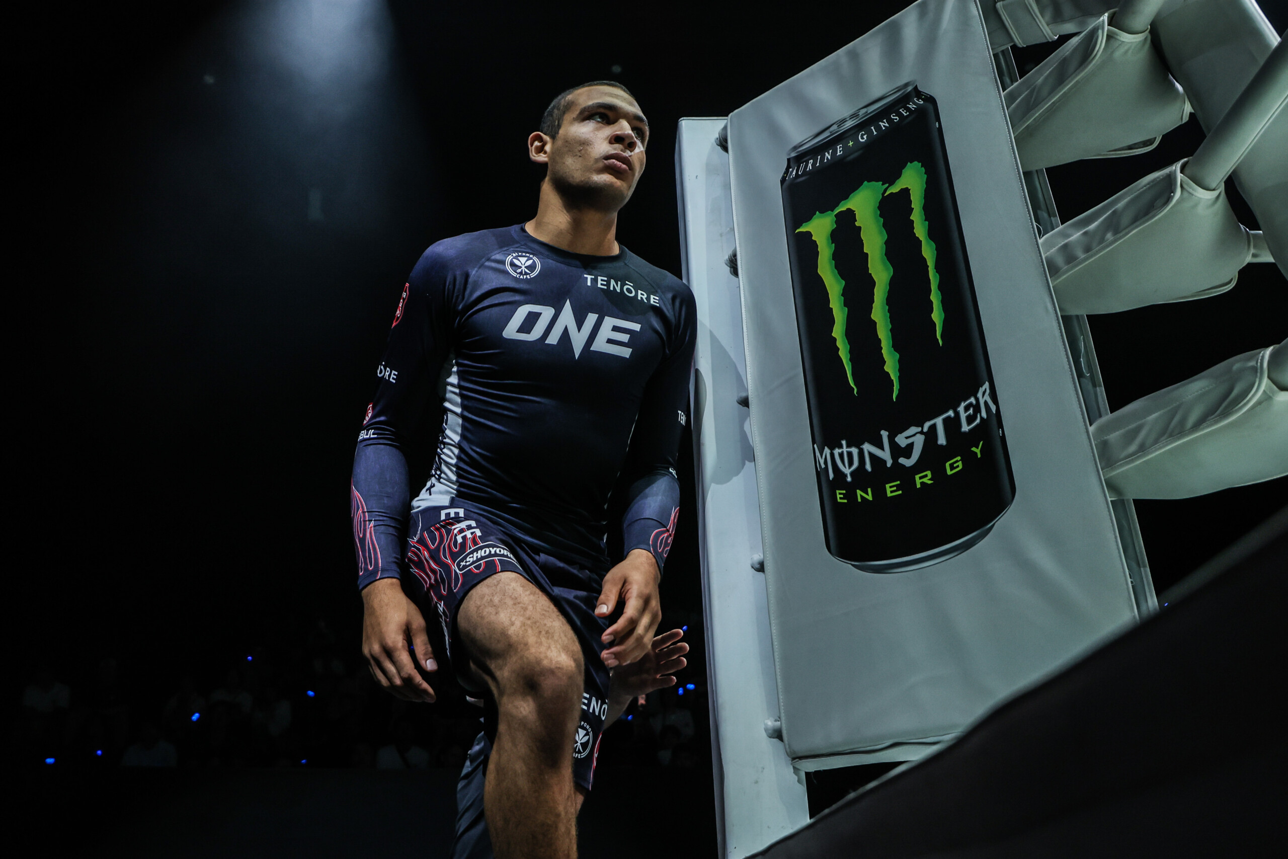 Submission Grappling World Champion Tye Ruotolo enters the ring near the Monster Energy banner