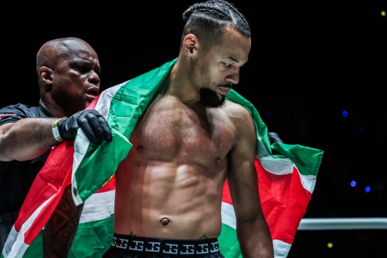 Regian Eersel poses with the Suriname flag against George Jarvis at ONE Fight Night 34
