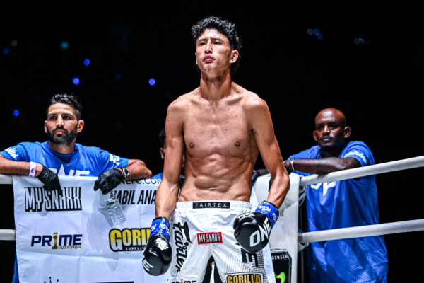 Nabil Anane stands in the ring corner