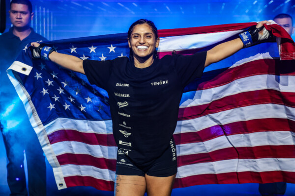 Natalie Salcedo carries the U.S. flag during her entrance at ONE Fight Night 35.