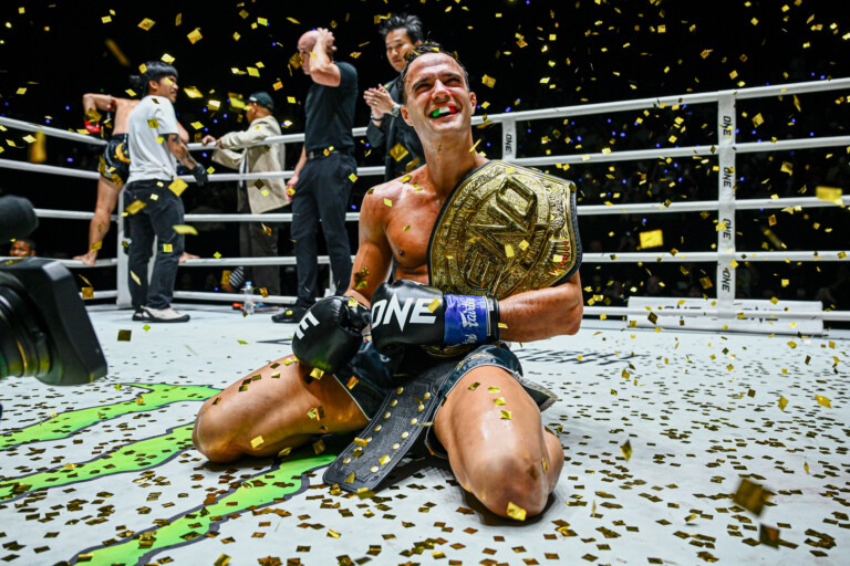 Italian-Canadian kickboxer Jonathan Di Bella with the ONE World Title belt