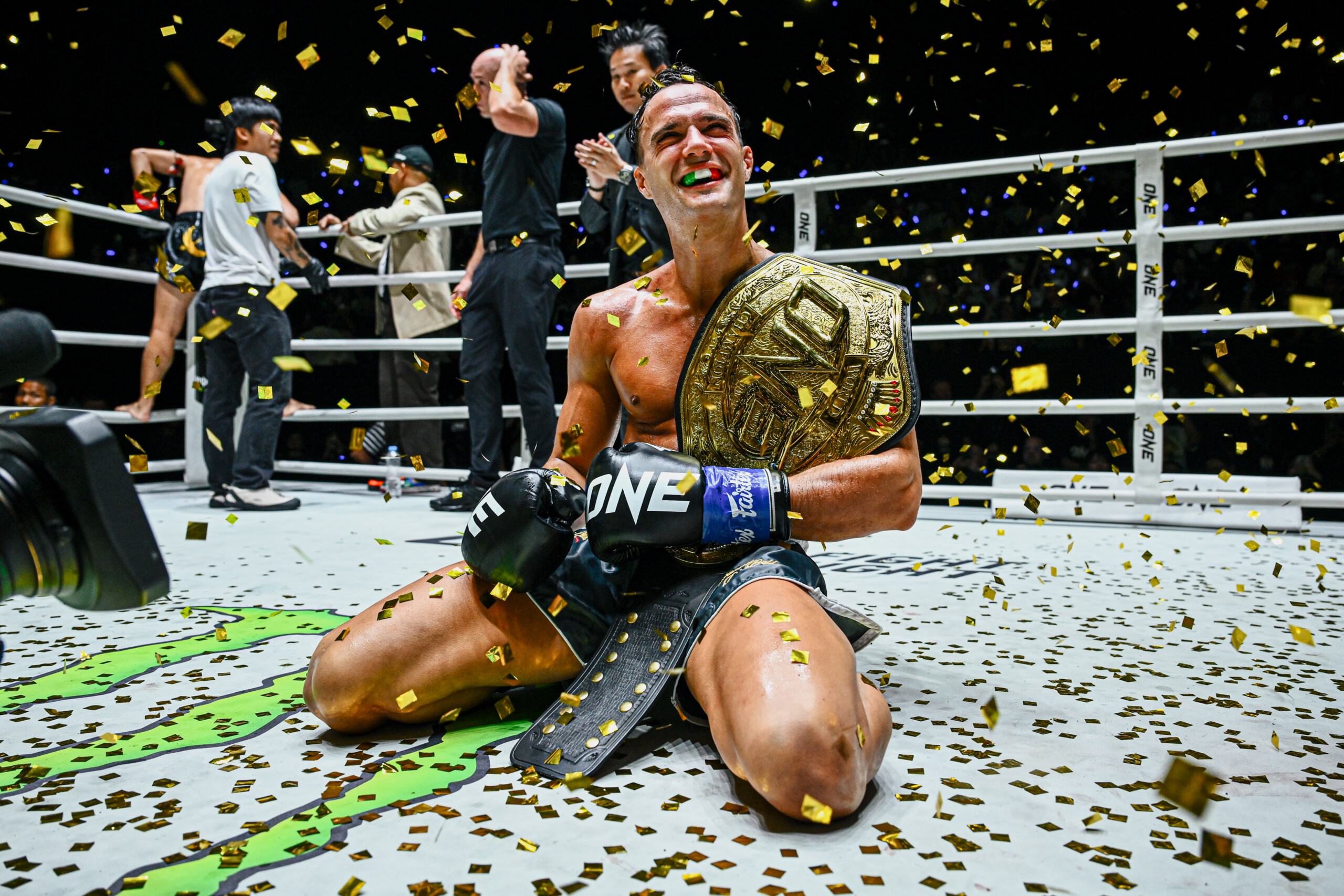 Italian-Canadian kickboxer Jonathan Di Bella with the ONE World Title belt