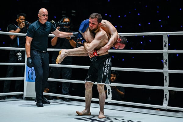 Mansur Malachiev carries Jarred Brooks over his shoulder at ONE Fight Night 36