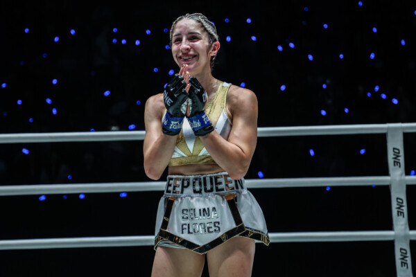 Muay Thai fighter celebrates a victory in the ring