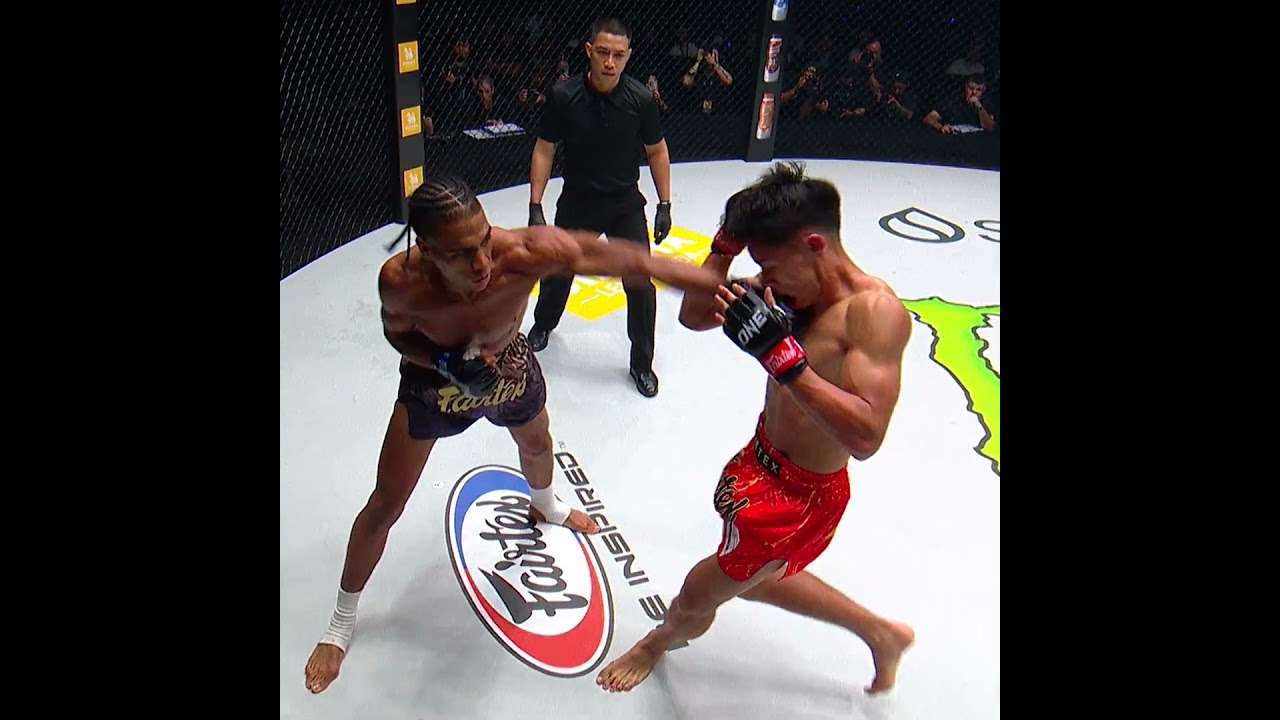 RIPPLING PUNCH  Johan Estupinan floors Johan Ghazali with a stunning blow!