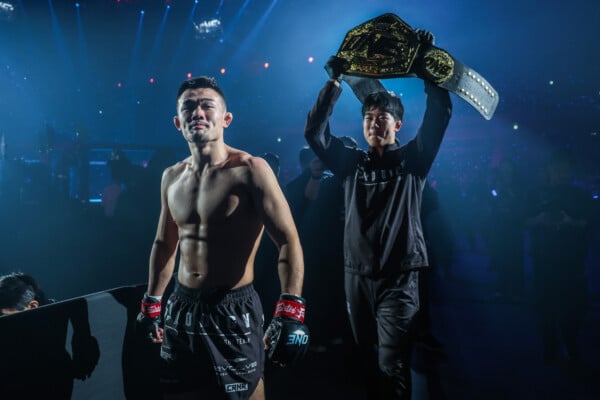 Christian Lee enters the Circle accompanied by his brother Adrian Lee