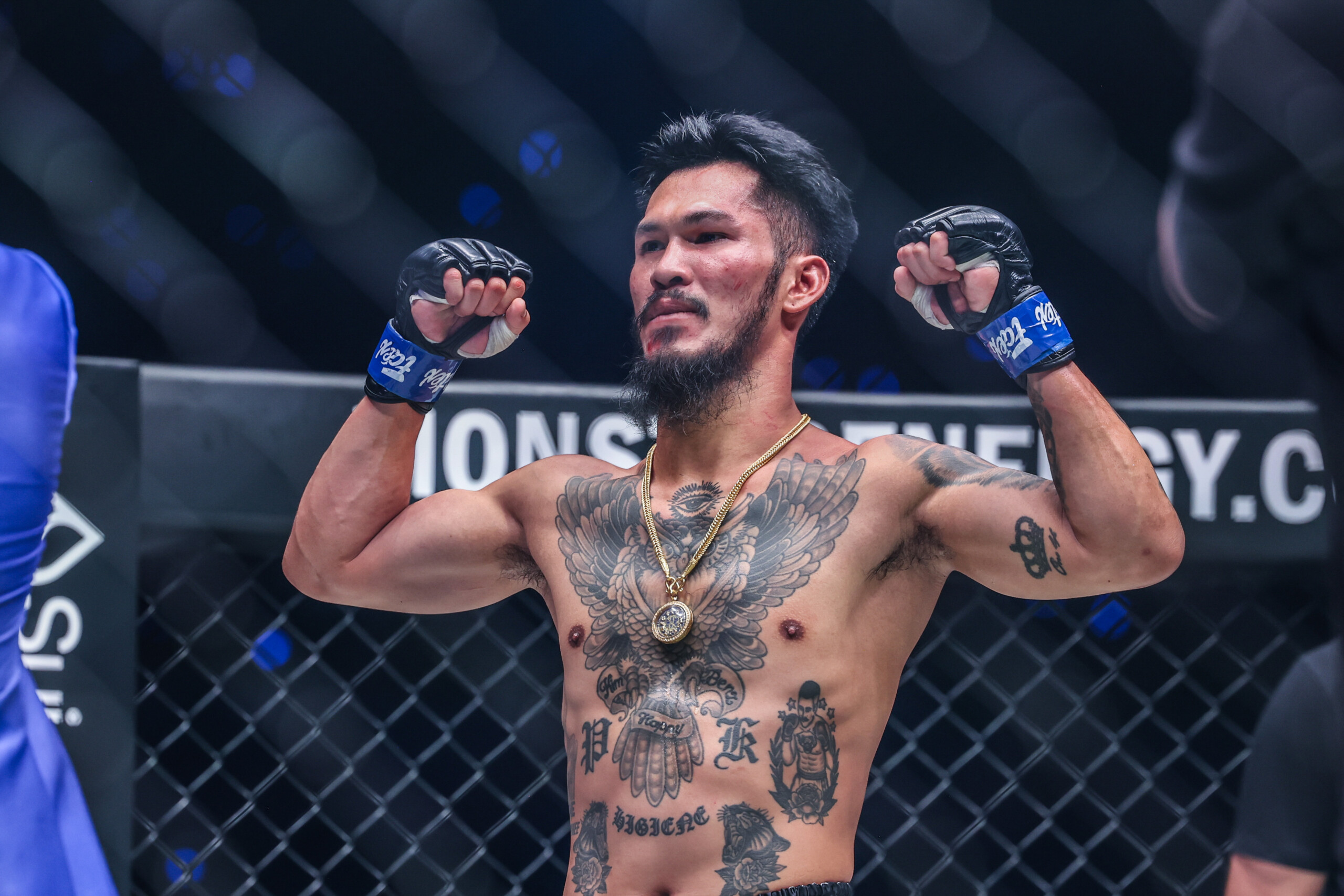 Suakim Sor Jor Tongprajin flexes before his match with Jake Peacock at ONE 173