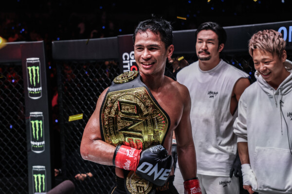 Superbon celebrates after defeating Masaaki Noiri at ONE 173.