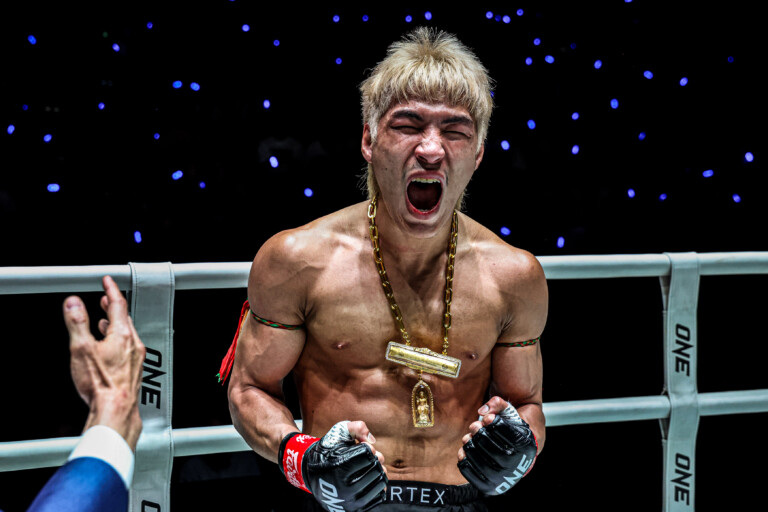 Yod IQ Or Pimolsri celebrates in the ring following his win