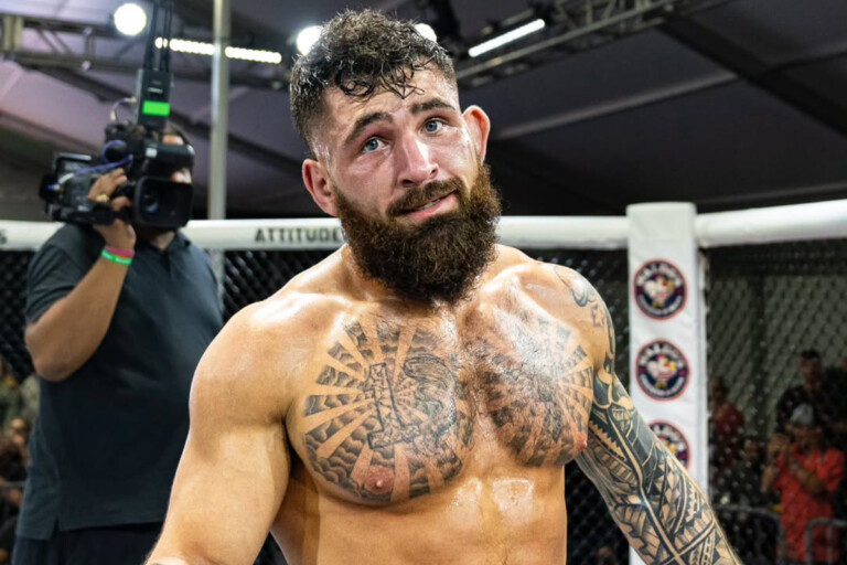 American MMA fighter Chase Mann stands inside the cage
