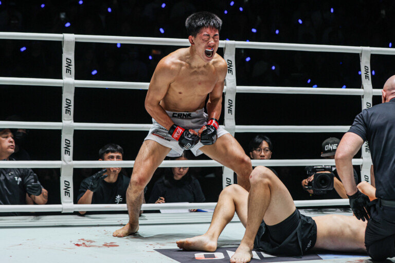 MMA fighter Adrian Lee screams in the ring following his win