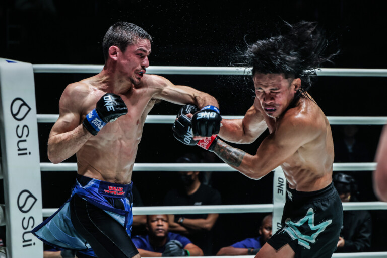 MMA fighter Willie van Rooyen cracks Jeremy Miado in the head.