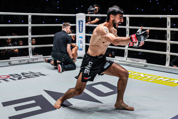 Lebanese Muay Thai fighter Abdallah Ondash celebrates his knockout victory in the ring