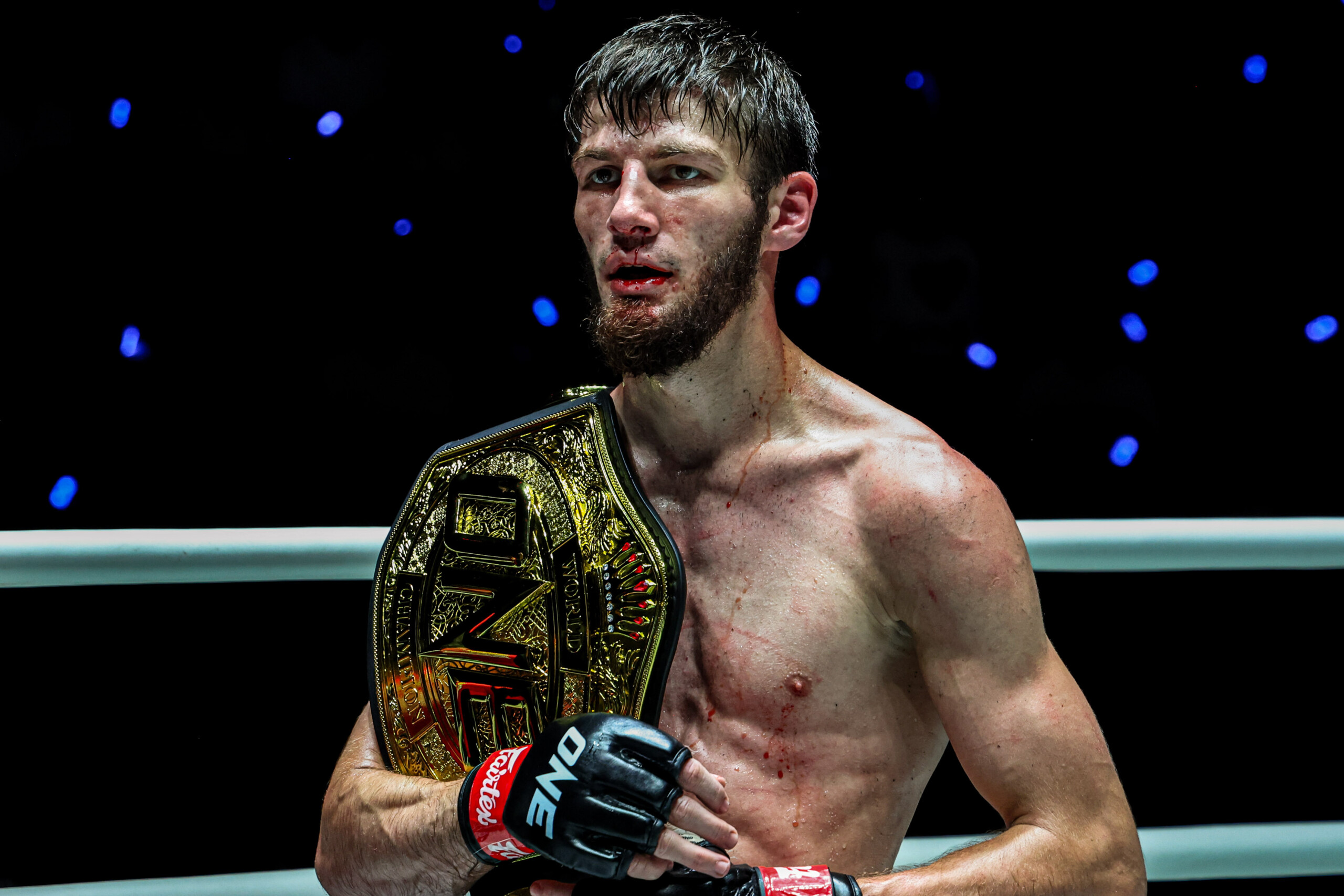 Asadula Imangazaliev celebrates his title win over Aslamjon Ortikov