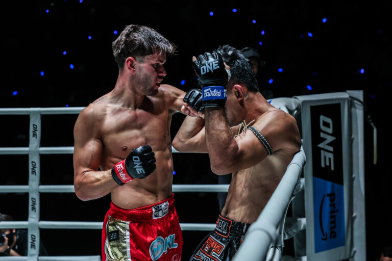 British Muay Thai fighter George Jarvis punches Rungrawee Sitsongpeenong to the head
