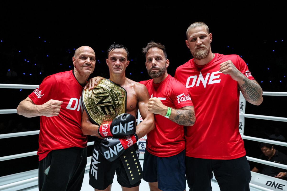 Jonathan Di Bella poses with his Strawweight Kickboxing World Championship at The Inner Circle 22