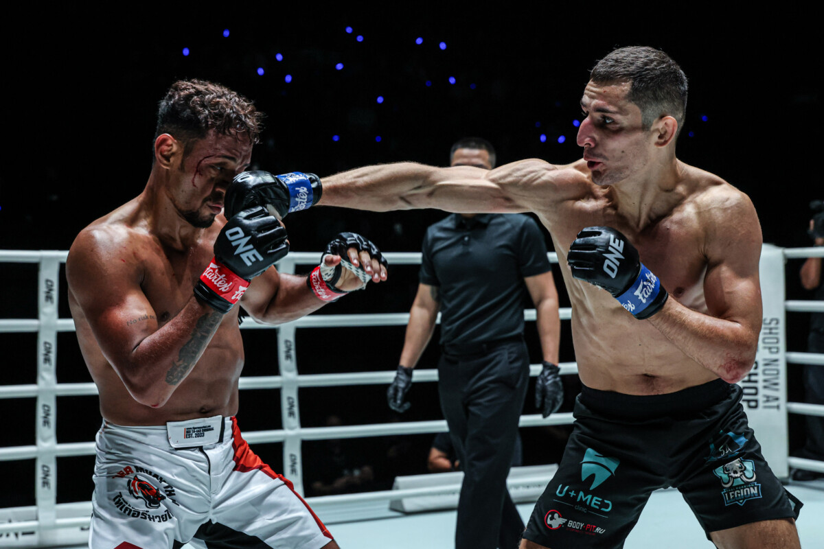 Russian Muay Thai fighter Dmitrii Kovtun punches Felipe Lobo in the face